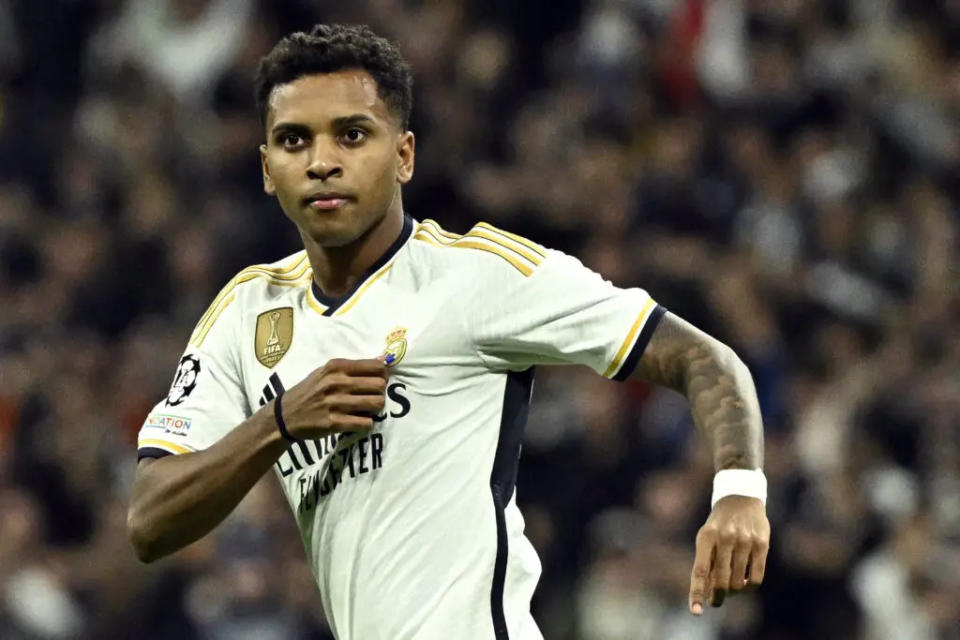 Real Madrid’s Brazilian forward #11 <a class="link " href="https://sports.yahoo.com/soccer/players/3871593/" data-i13n="sec:content-canvas;subsec:anchor_text;elm:context_link" data-ylk="slk:Rodrygo;sec:content-canvas;subsec:anchor_text;elm:context_link;itc:0">Rodrygo</a> celebrates scoring his team’s first goal during the UEFA Champions League first round group C football match between Real Madrid CF and SSC Naples at the Santiago Bernabeu stadium in Madrid on November 29, 2023. (Photo by JAVIER SORIANO / AFP) (Photo by JAVIER SORIANO/AFP via Getty Images)