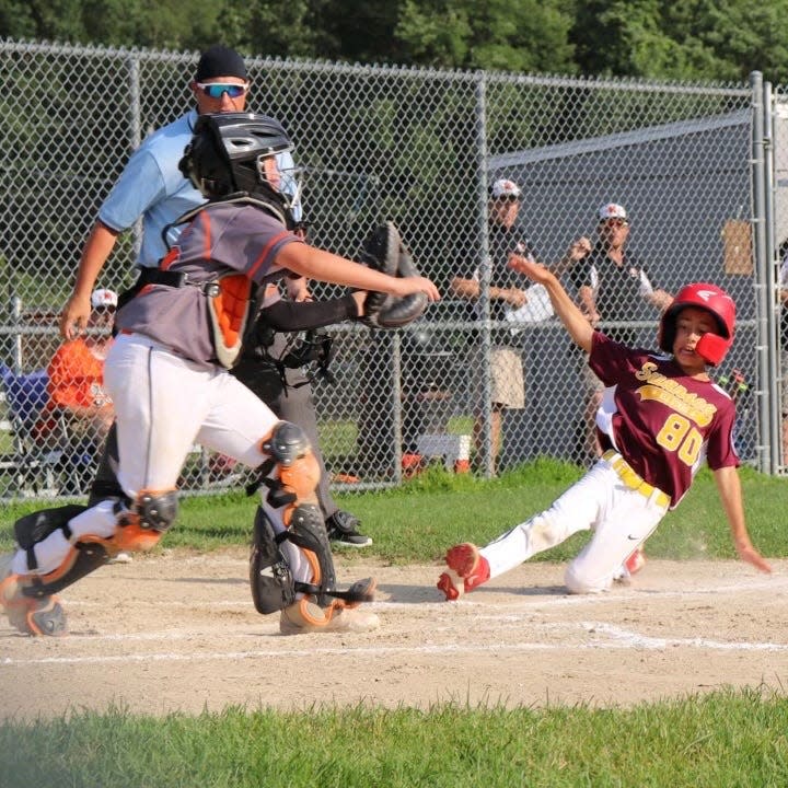 Brayden Cabral slides home safely during a Swansea Little League all stars game.