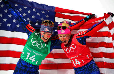 Cross-Country Skiing - Pyeongchang 2018 Winter Olympics - Women's Team Sprint Free Finals - Alpensia Cross-Country Skiing Centre - Pyeongchang, South Korea - February 21, 2018 - Jessica Diggins and Kikkan Randall of the U.S. celebrate. REUTERS/Carlos Barria