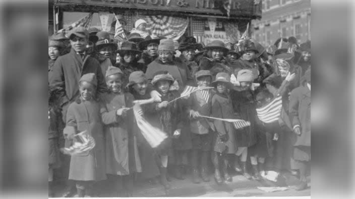 African-American families lined the streets of New York to celebrate the homecoming of the 369th Army infantry unit in 1919. (Photo: Image courtesy of the National Archives and Records Administration)