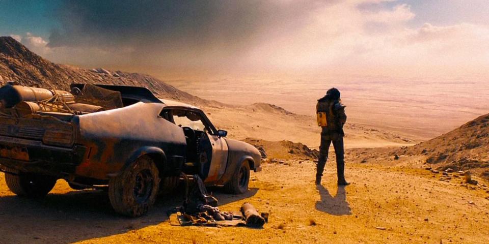 Tom Hardy as Max Rockatansky next to his car in "Mad Max: Fury Road."