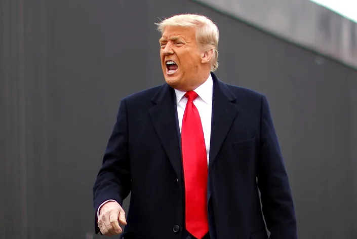 U.S. President Donald Trump yells as he visits the U.S.-Mexico border wall, in Alamo, Texas, U.S., January 12, 2021. REUTERS/Carlos Barria