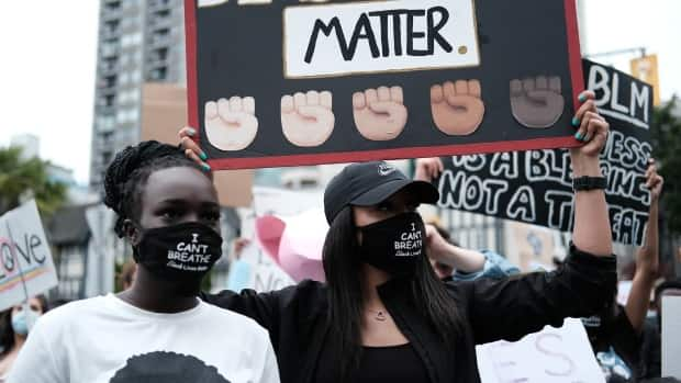 Thousands protesting systemic racism march along Thurlow Street in Vancouver  in 2020. (Gian Paolo Mendoza/CBC - image credit)