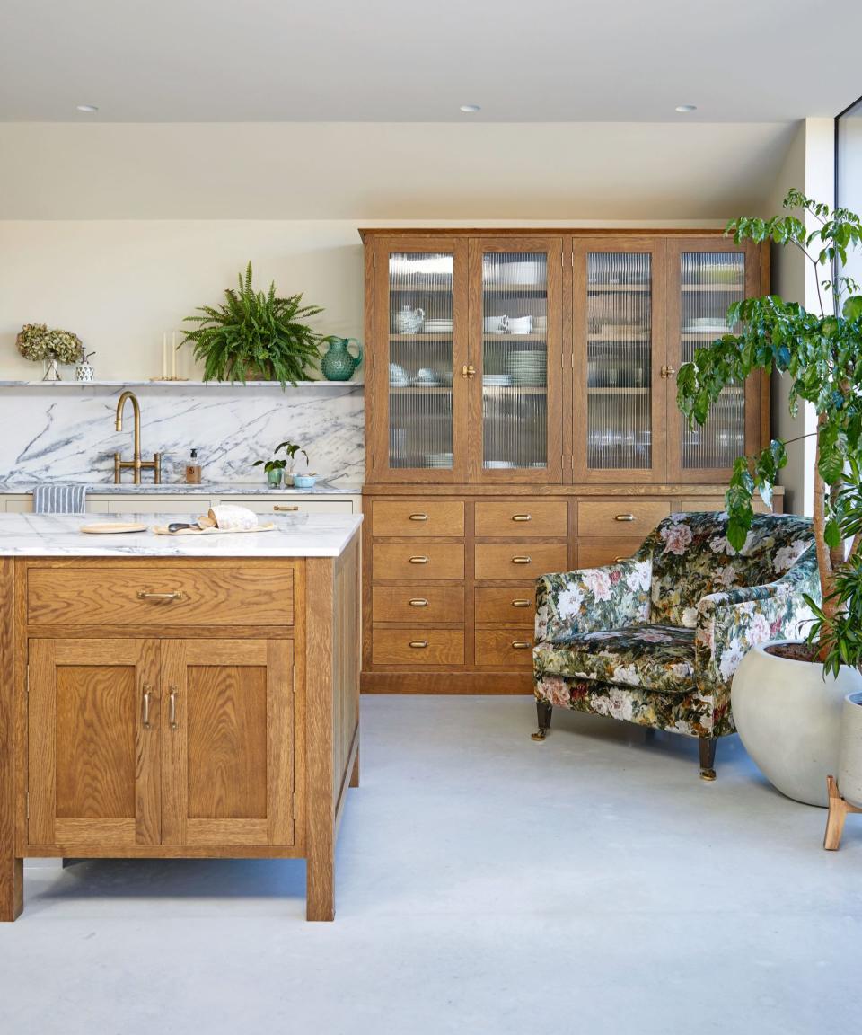 Wooden kitchen with white countertops