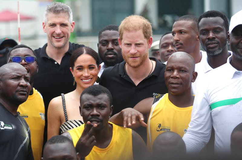 Britain's Prince Harry, Duke of Sussex and his wife Meghan, Duchess of Sussex meet with wounded army veterans in Abuja