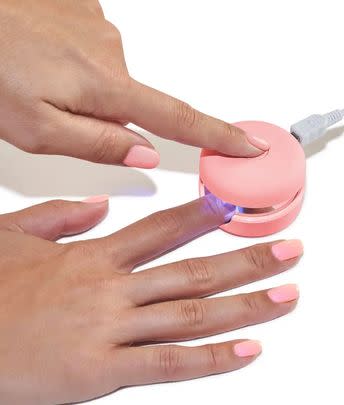 An at-home gel manicure kit with a mini LED lamp