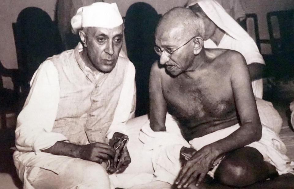 Pandit Jawaharlal Nehru, later Prime Minister of India, (left) with Mohandas Karamchand Gandhi (1869 - 1948). (Photo by: Universal History Archive/ Universal Images Group via Getty Images)