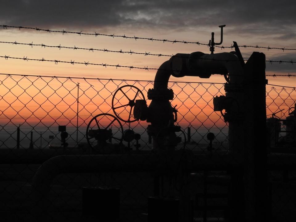 A natural gas pipeline at sunset.