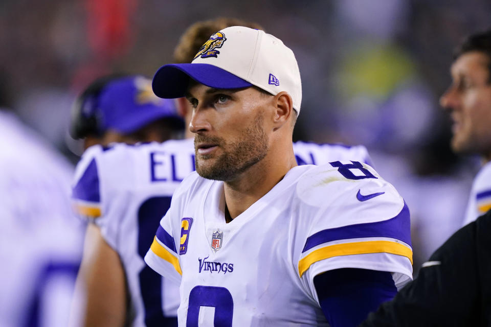 Minnesota Vikings quarterback Kirk Cousins (8) watches from the sideline during the second half of an NFL football game against the Philadelphia Eagles, Monday, Sept. 19, 2022, in Philadelphia. (AP Photo/Matt Rourke)