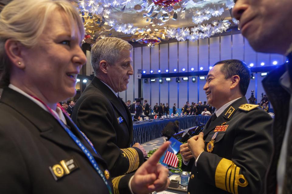 Steve Koehler, commander of the U.S. Pacific Fleet, second from left chats with Vietnam's representative Tran Thanh Nghiem, second from right, at the Western Pacific Navy Symposium in Qingdao in eastern China's Shandong province on Monday, April 22, 2024. The meeting has drawn representatives from partners and competitors including Australia, Cambodia, Chile, France, India and the U.S. and comes amid heightened tensions over China's assertive actions in the Taiwan Strait and the East and South China seas, and as China's navy has grown into the world's largest by number of hulls. (AP Photo/Ng Han Guan)