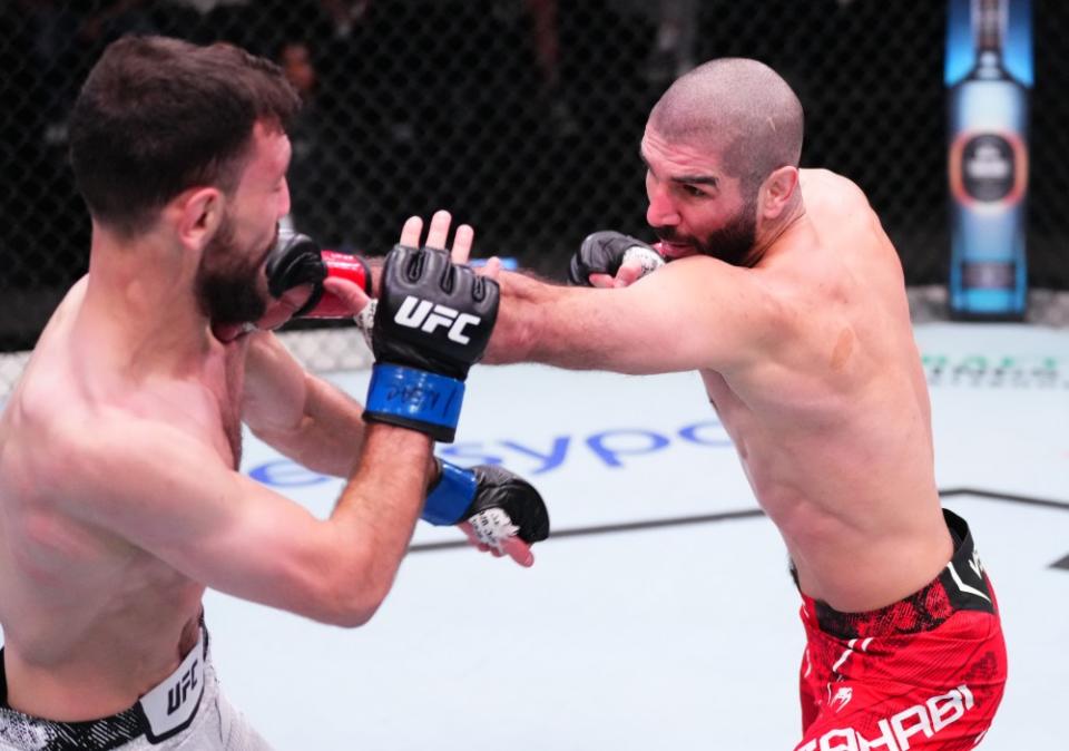 LAS VEGAS, NEVADA – MARCH 02: (R-L) Aiemann Zahabi of Canada punches Javid Basharat of Afghanistan in a bantamweight bout during the UFC Fight Night event at UFC APEX on March 02, 2024 in Las Vegas, Nevada. (Photo by Jeff Bottari/Zuffa LLC via Getty Images)