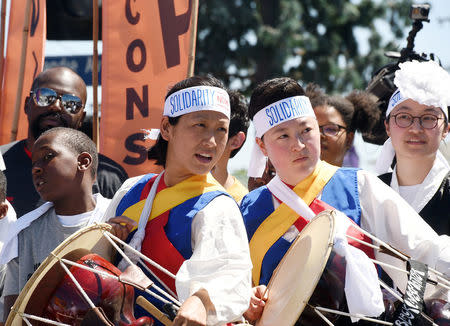 Korean drummers take part in a solidarity march in the intersection of Florence and Normandie Avenue, the flashpoint where the riots started 25 years ago, to remember and honor the victims of the 1992 Los Angeles riots in Los Angeles, California, U.S., April 29, 2017. REUTERS/Kevork Djansezian