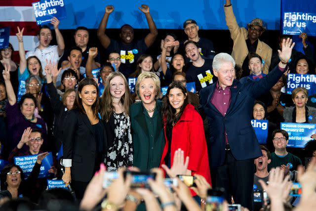 <p>Bill Clark/CQ Roll Call</p> Eva Longoria, Chelsea Clinton, Hillary Clinton, America Ferrera and Bill Clinton wave to the crowd on stage during the Hillary Clinton campaign rally at the Clark County Government Center Amphitheater in Las Vegas on Friday night,