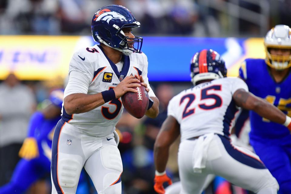 Dec 10, 2023; Inglewood, California, USA; Denver Broncos quarterback Russell Wilson (3) moves out to pass against the Los Angeles Chargers during the second half at SoFi Stadium. Mandatory Credit: Gary A. Vasquez-USA TODAY Sports