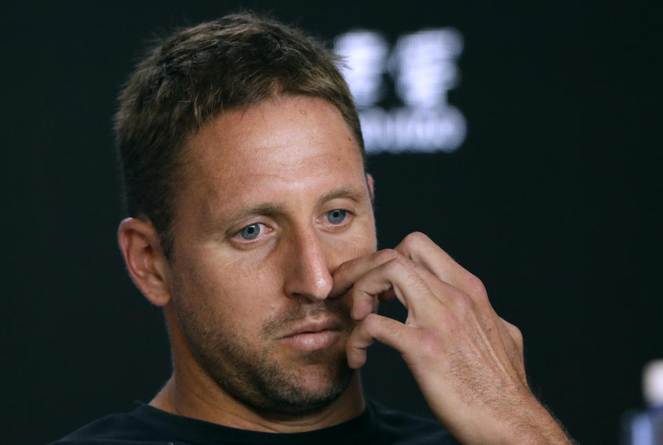 Tennys Sandgren of the U.S. answers questions at a press conference following his quarterfinal loss to Switzerland's Roger Federer at the Australian Open tennis championship in Melbourne, Australia, Tuesday, Jan. 28, 2020. (AP Photo/Mark Baker)