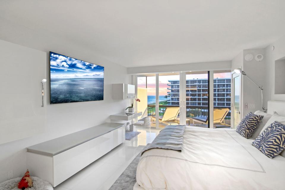 The bed in the main bedroom is positioned to capture the ocean view. The apartment also has views of the Intracoastal Waterway.