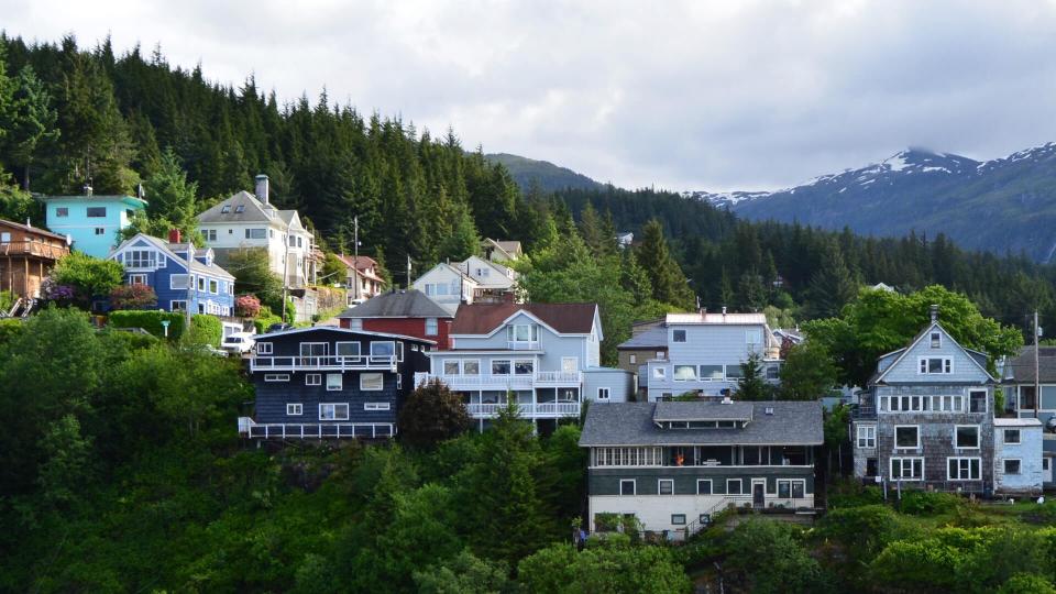 Many homes sit high on a ridge with a waterfront view of the port of Ketchikan in Alaska.