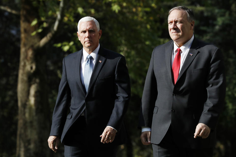 Vice President Mike Pence, left, and Secretary of State Mike Pompeo leave the Ambassador’s Residence as they walk to a motorcade en route to the Presidential Palace for talks on the Kurds and Syria, Thursday, Oct. 17, 2019, in Ankara, Turkey. (AP Photo/Jacquelyn Martin)