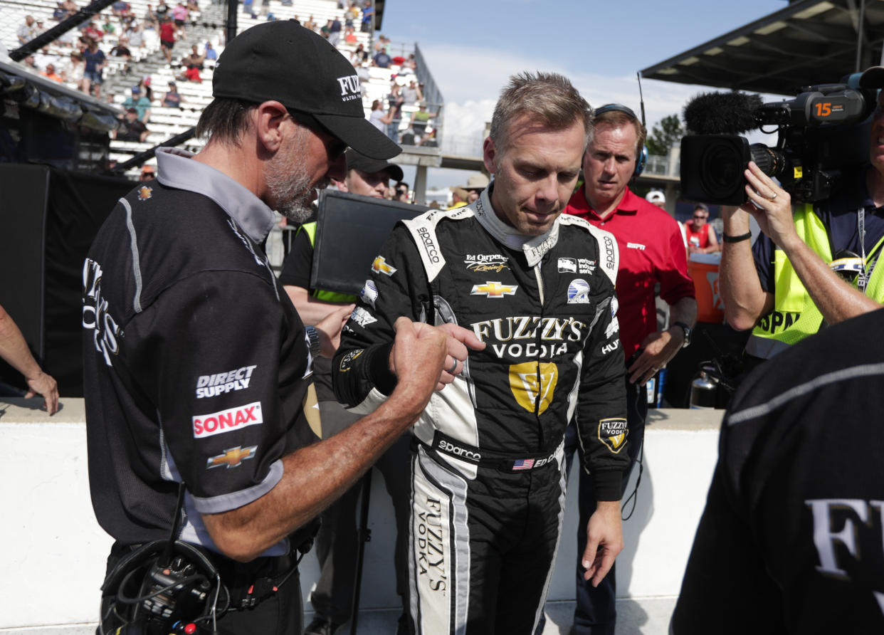 Ed Carpenter bumps fist with a member of his crew after he qualified for the IndyCar Indianapolis 500 auto race at Indianapolis Motor Speedway in Indianapolis, Saturday, May 19, 2018. (AP Photo/Michael Conroy)