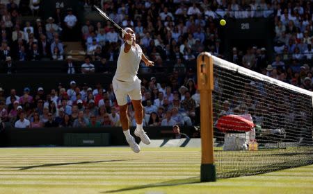 Tennis - Wimbledon - All England Lawn Tennis and Croquet Club, London, Britain - July 11, 2018. Switzerland's Roger Federer in action during his quarter final match against South Africa's Kevin Anderson. REUTERS/Andrew Boyers