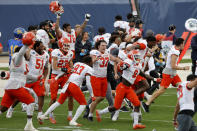 Sam Houston players celebrate as they defeat South Dakota State in the NCAA college FCS Football Championship in Frisco, Texas, Sunday, May 16, 2021. (AP Photo/Michael Ainsworth)