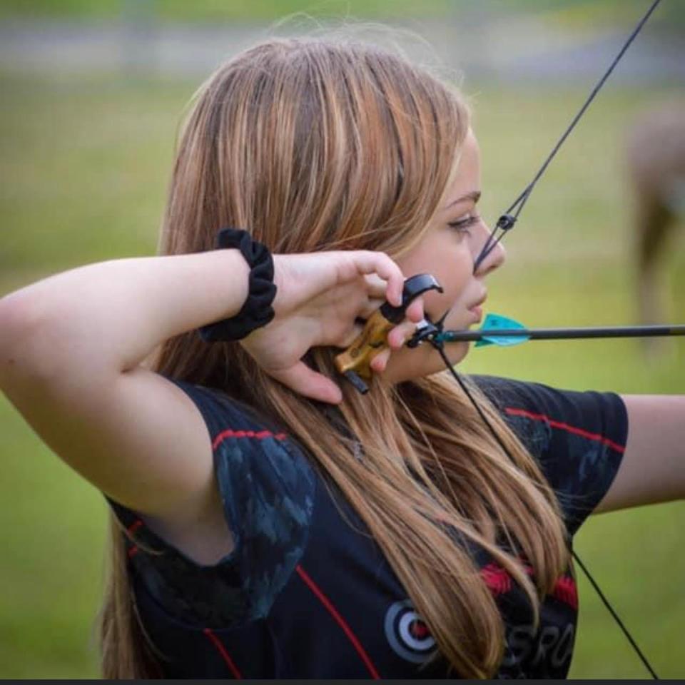 Marisa Cox of Powell takes careful aim.