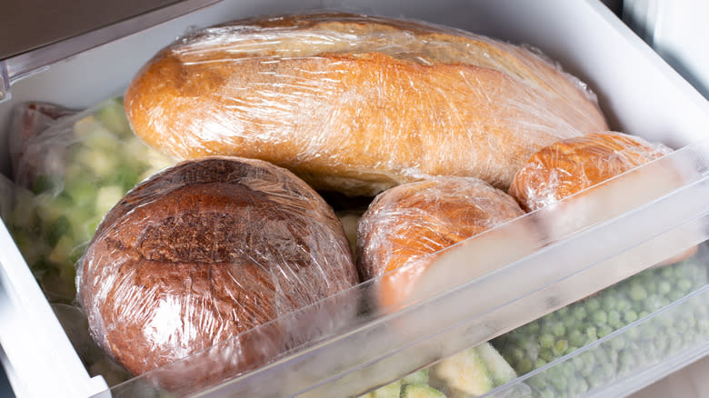 Loaves of bread wrapped and stored in the refrigerator