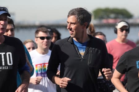 FILE PHOTO: Democratic 2020 U.S. presidential candidate Beto O'Rourke jogs a 2 mile run with members of the LGBTQ community along the Hudson River Greenway in New York City