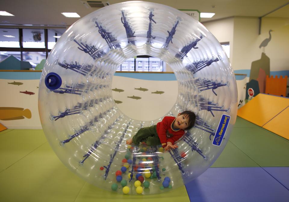 Two-year-old Sakuya Zui plays at an indoor playground which was built for children and parents who refrain from playing outside because of concerns about nuclear radiation in Koriyama, west of the tsunami-crippled Fukushima Daiichi nuclear power plant, Fukushima prefecture February 27, 2014. (REUTERS/Toru Hanai)