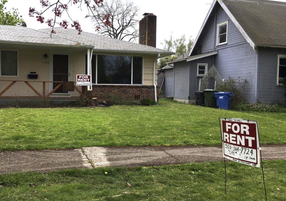 FILE - This April 22, 2017 file photo shows For Rent signs in front of a house in Salem, Ore. A committee of the Oregon House of Representatives debated a bill that would make Oregon the first state to impose mandatory rent controls statewide. The committee on Wednesday, Feb. 20, 2019, rejected proposed amendments that would make certain parts of the state exempt from the bill. (AP Photo/Andrew Selsky, File)