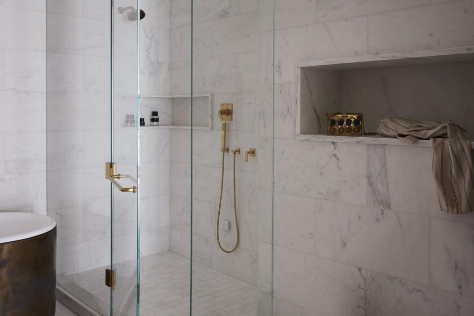 A bathroom shower with niches