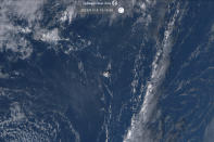 This satellite image taken by Himawari-8, a Japanese weather satellite operated by Japan Meteorological Agency and released by National Institute of Information and Communications Technology (NICT), shows an undersea volcano eruption at the Pacific nation of Tonga Saturday, Jan. 15, 2022. (NICT via AP)