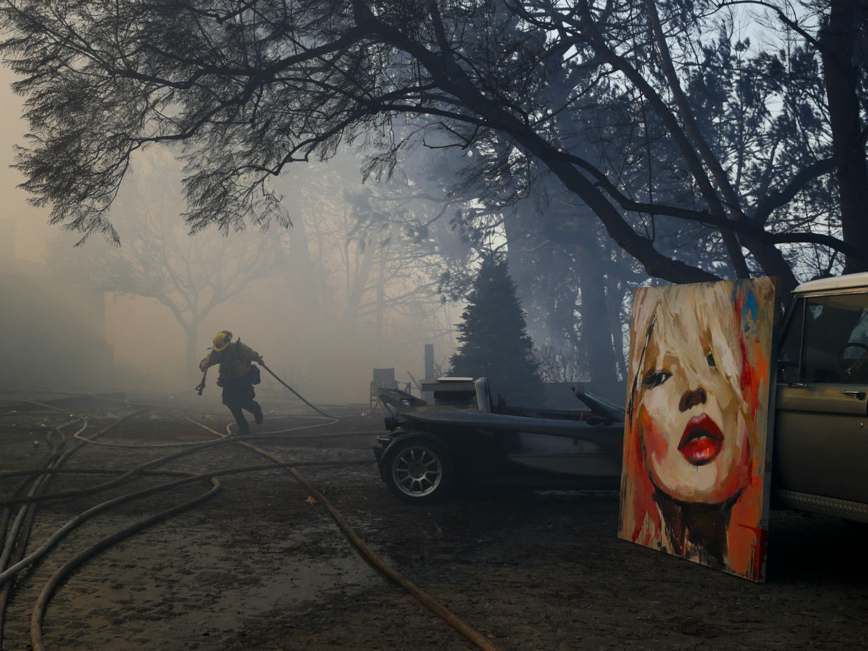 Firefighters have saved a number of paintings and other possessions in Bel Air: AP