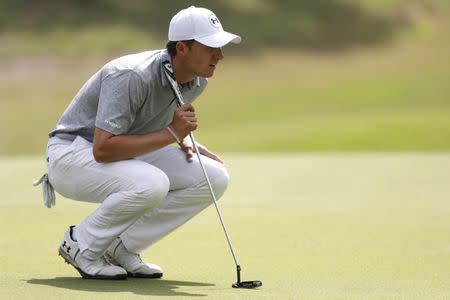 Mar 22, 2017; Austin, TX, USA; Jordan Spieth of the United States lines up a putt against Hideto Tanihara of Japan during the first round of the World Golf Classic - Dell Match Play golf tournament at Austin Country Club. Erich Schlegel-USA TODAY Sports