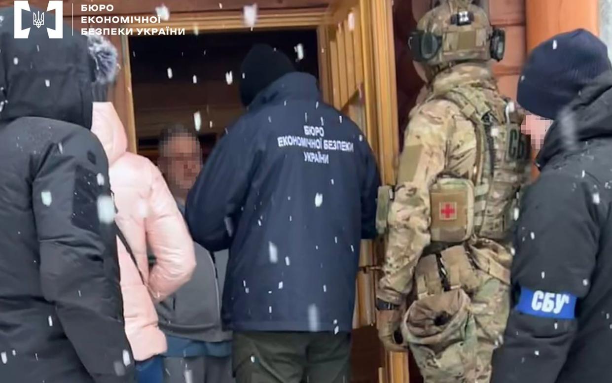 Detectives entering the house of Ukrainian business tycoon Ihor Kolomoisky (third from left) in Dnipro on Feb 1 - Shutterstock