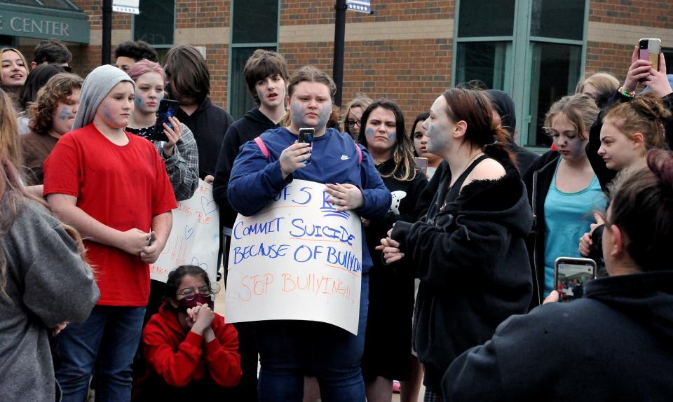 Students unite with parents in front of Wooster High School on April 17, during an anti-bullying demonstration. Students walked out of class in a show of solidarity with Orrville High School, where a walkout had taken place three days earlier.