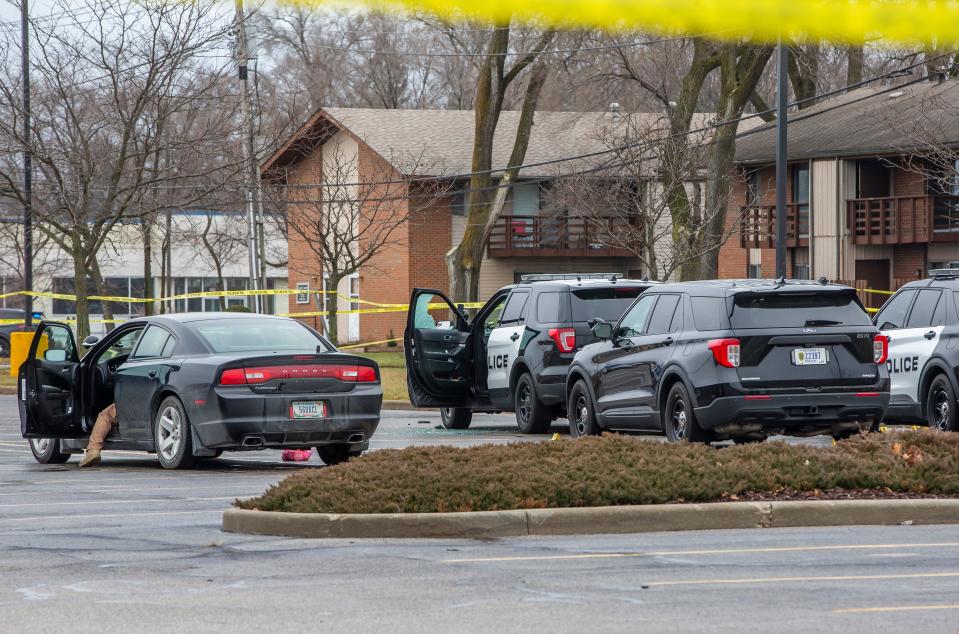 A police vehicle is seen with a broken window as police investigate after a fatal shooting by an officer in a parking lot near West Hively Avenue on Wednesday, Dec. 15, 2021, in Elkhart. 