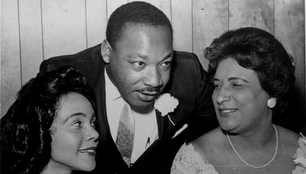 In this Aug. 9, 1965, file photo, Dr. Martin Luther King, Jr., president of the Southern Christian Leadership Conference, chats with his wife, Coretta, left, and civil rights champion Constance Baker Motley before the start of an S.C.L.C. banquet in Birmingham, Ala. (AP Photo/File)