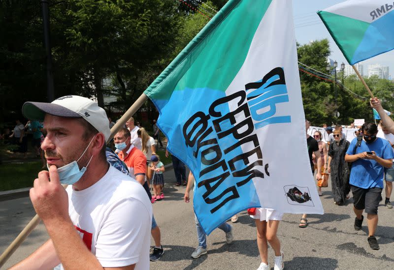 People take part in a rally in support of arrested governor Sergei Furgal in Khabarovsk