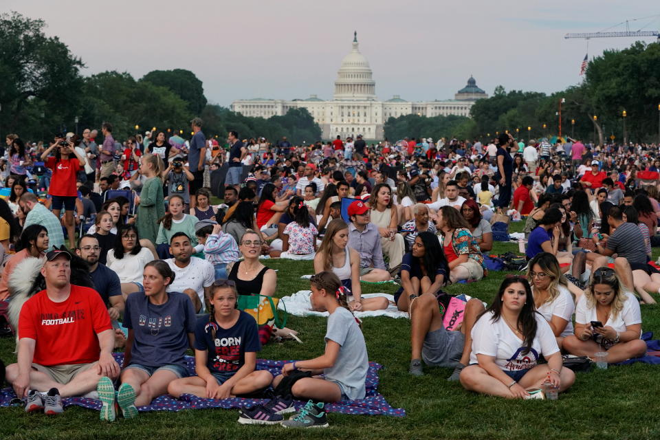 People gather for the annual Independence Day fireworks celebration at the National Mall in Washington, U.S., July 4, 2021.  REUTERS/Joshua Roberts