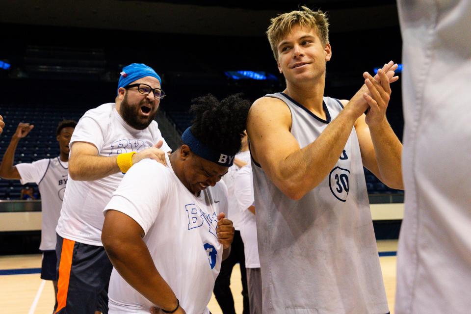 Sean Walker, left, congratulates Ronald Weaver III after their team’s victory at Media Madness, an event hosted by the BYU men’s basketball program, at the Marriott Center in Provo on Monday, Oct. 9, 2023. | Megan Nielsen, Deseret News