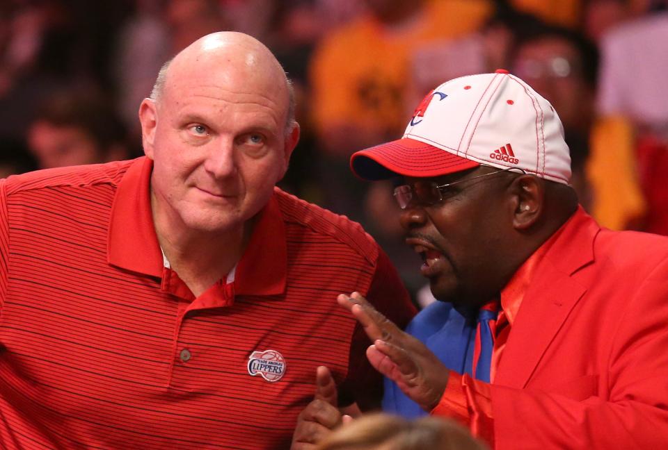 LOS ANGELES, CA - OCTOBER 31:   Los Angeles Clippers owner Steve Ballmer (L) talks with Cliipers superfan Darrell Bailey, also known as Clipper Darrell, during the game against the Los Angeles Lakers at Staples Center on October 31, 2014 in Los Angeles, California. The Clippers won 118-111.  NOTE TO USER: User expressly acknowledges and agrees that, by downloading and or using this photograph, User is consenting to the terms and conditions of the Getty Images License Agreement.  (Photo by Stephen Dunn/Getty Images)