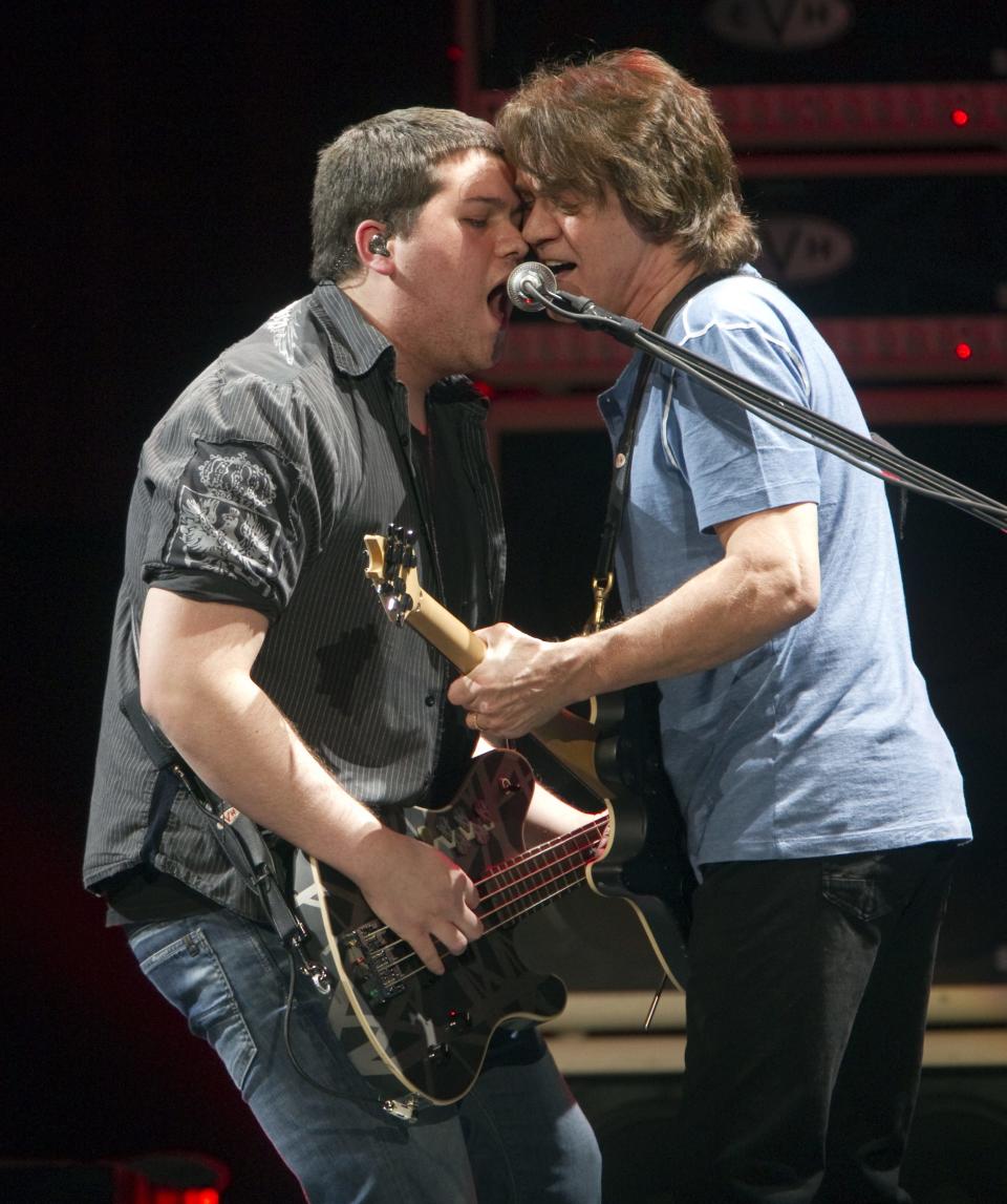 Wolfgang Van Halen, left, and dad Eddie Van Halen on stage in Indianapolis in 2012.