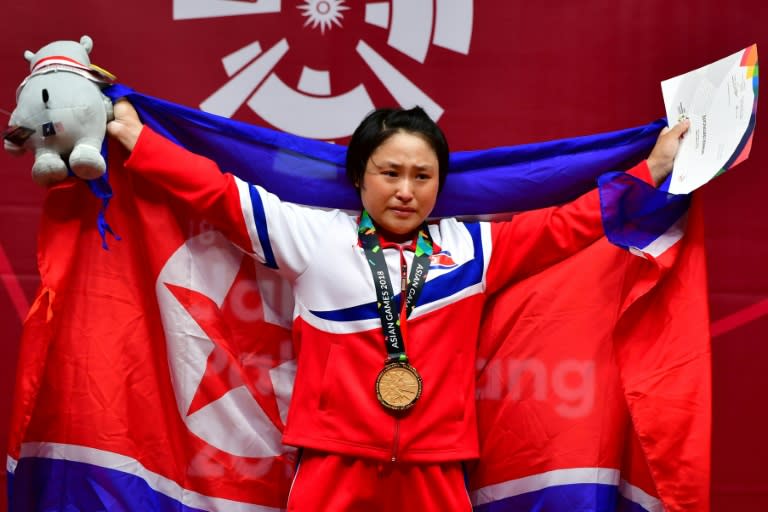 North Korea's Ri Song Gum tried twice to attempt an Asian Games record and personal best of 117kg but departed in agony as her left knee buckled