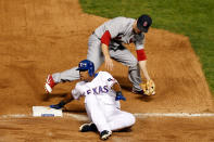 ARLINGTON, TX - OCTOBER 22: Adrian Beltre #29 of the Texas Rangers is safe at third base after the tag by Ryan Theriot #3 of the St. Louis Cardinals in the seventh inning during Game Three of the MLB World Series at Rangers Ballpark in Arlington on October 22, 2011 in Arlington, Texas. (Photo by Tom Pennington/Getty Images)