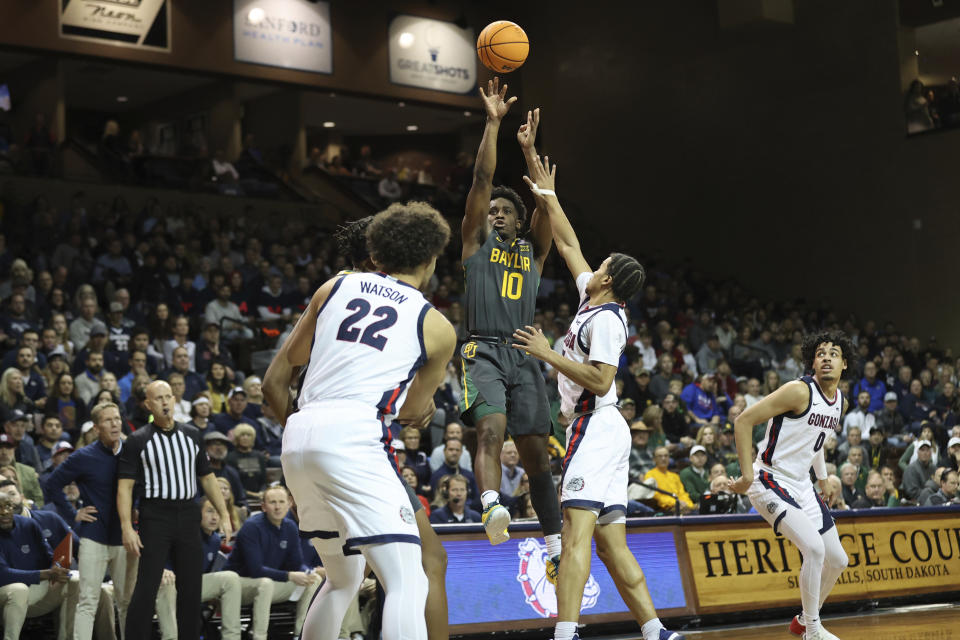 Baylor guard Adam Flagler (10) shoots a fadeaway jump shot during the first half of an NCAA college basketball game against Gonzaga, Friday, Dec. 2, 2022, in Sioux Falls, S.D. (AP Photo/Josh Jurgens)