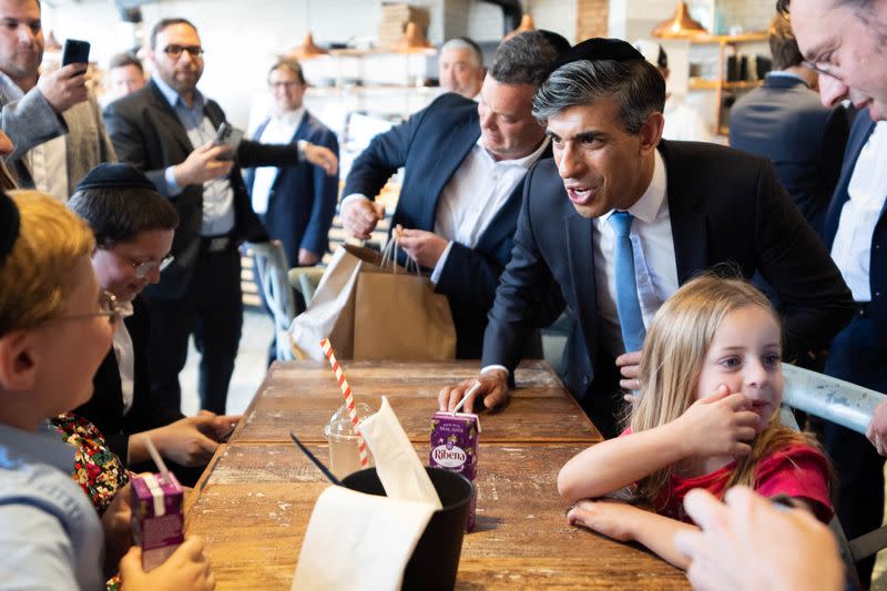 Britain's Prime Minister Rishi Sunak visits Machzike Hadath Synagogue in London