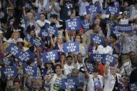 Delegates hold up signs in support of Hillary Clinton on Day 1 of the Democratic National Convention in Philadelphia, Pennsylvania, July 25, 2016