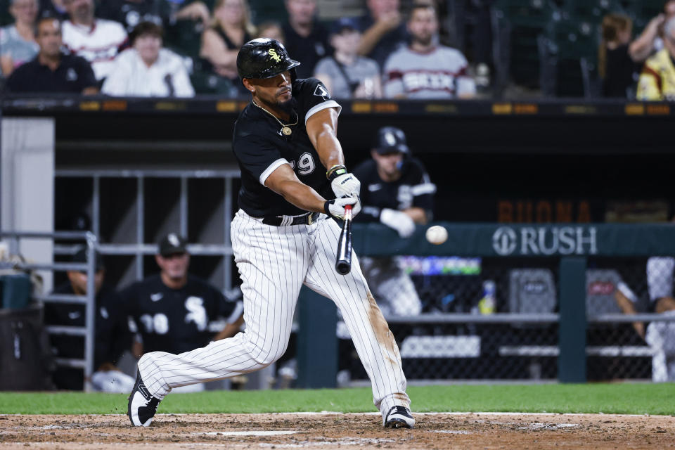Chicago White Sox's Jose Abreu hits an RBI single off Kansas City Royals relief pitcher Collin Snider during the seventh inning of a baseball game Wednesday, Aug. 31, 2022, in Chicago. (AP Photo/Kamil Krzaczynski)