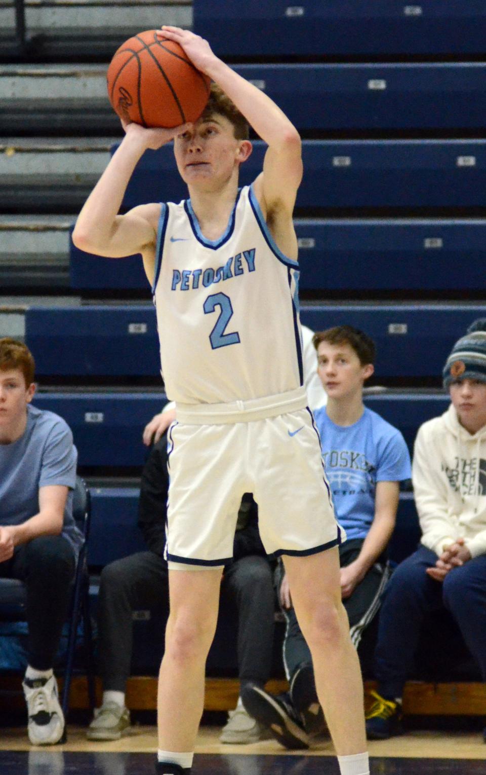 Petoskey's Brady Odenbach lines up and hits a 3-pointer in the corner in the second half.